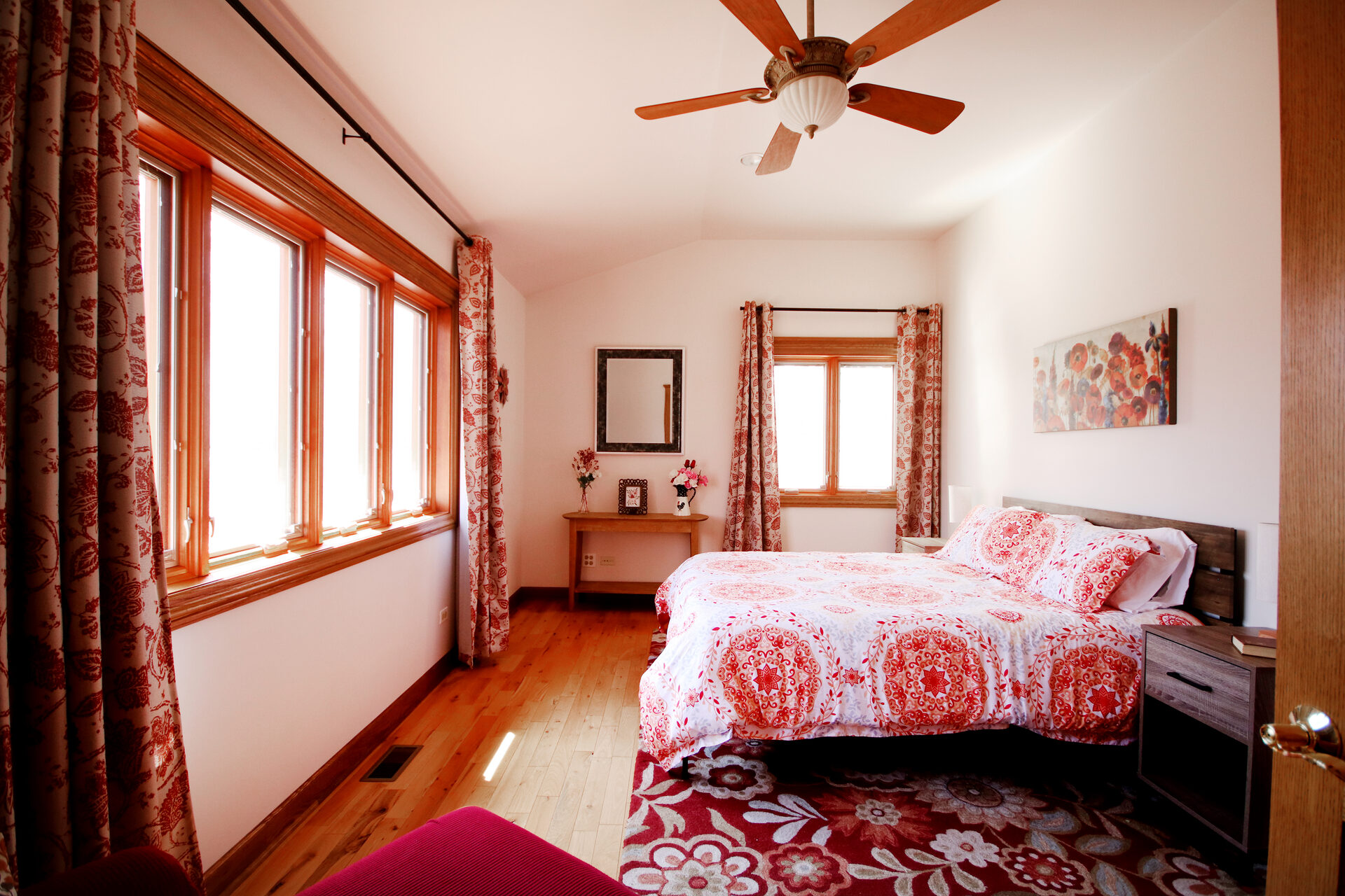 Red bedroom with wooded views